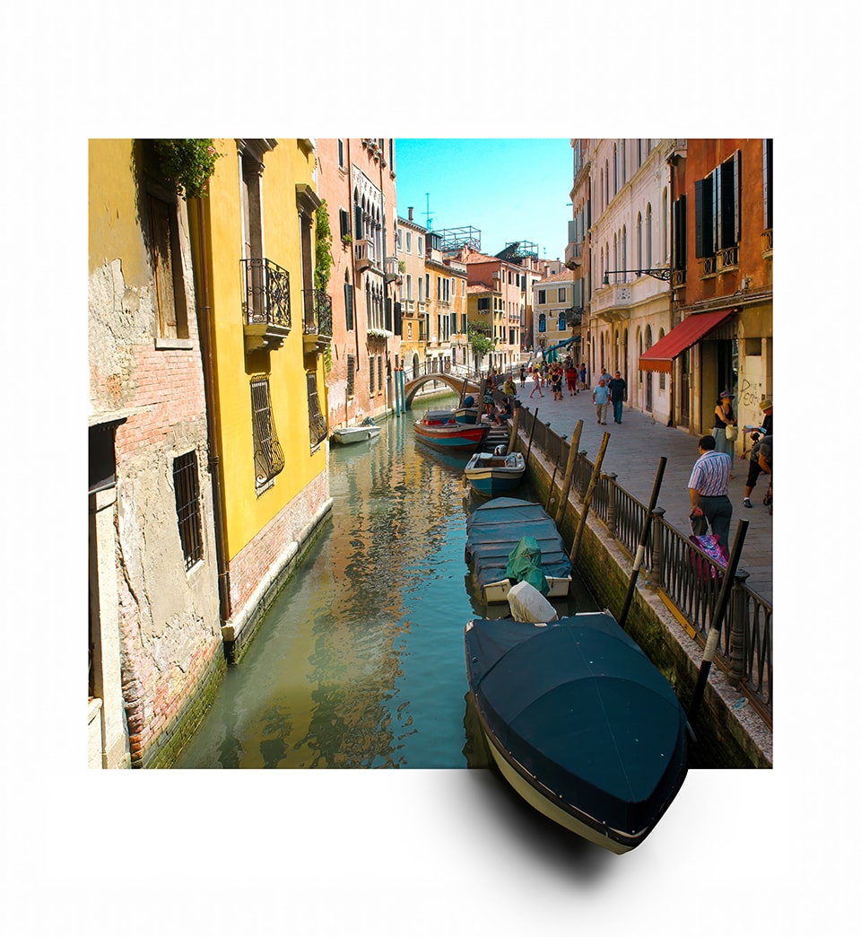 A vibrant slice of Venetian life bursts beyond its frame, inviting you to step into the scene. The tranquil canal, flanked by sun-drenched, pastel-hued buildings, teems with boats and the bustle of daily life. A dark gondola in the foreground seems to float off the page, bridging the gap between art and reality. This piece captures the timeless charm of Venice, where every corner tells a story and every view is a masterpiece waiting to be experienced.